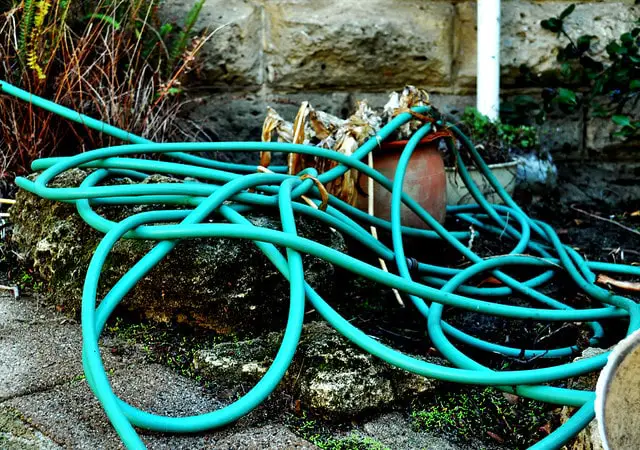 Fix tangled hoses with a hose reel.