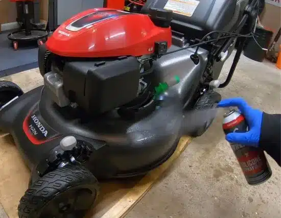 Spray for corrosion prevention to winterize your lawn mower